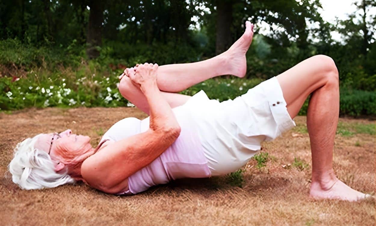 Lie Down Outside and Pull One Knee to Your Chest